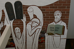 The library mural shows how the Word of God has been passed on from generation to generation.